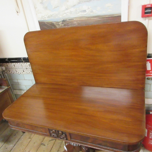 720 - A REGENCY MAHOGANY FOLDING BREAKFAST TABLE, early 19th century, the rounded oblong swivel top over p... 