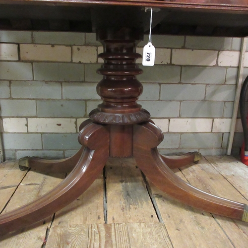 720 - A REGENCY MAHOGANY FOLDING BREAKFAST TABLE, early 19th century, the rounded oblong swivel top over p... 