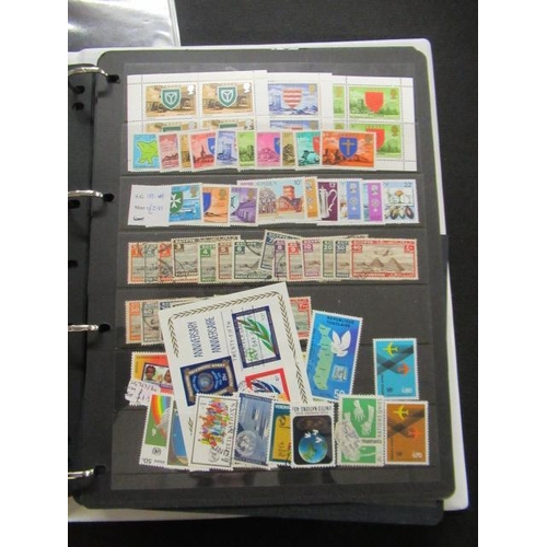 573 - TWO ALBUMS OF MAINLY MINT UK AND WORLD STAMPS