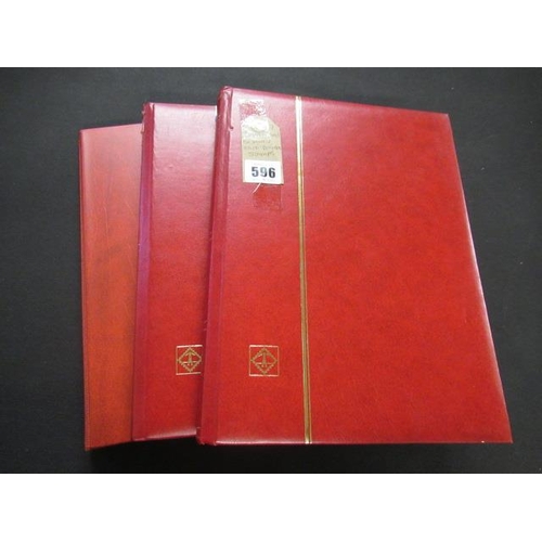 596 - THREE RED ALBUMS OF MINT AND USED DECIMAL STAMPS