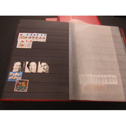 596 - THREE RED ALBUMS OF MINT AND USED DECIMAL STAMPS