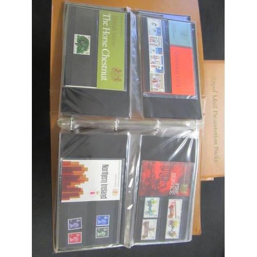 598 - THREE ALBUMS OF MINT DECIMAL PRESENTATION PACKS OF STAMPS