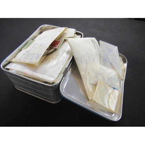 607 - TIN OF STAMPS IN PACKETS AND ENVELOPES