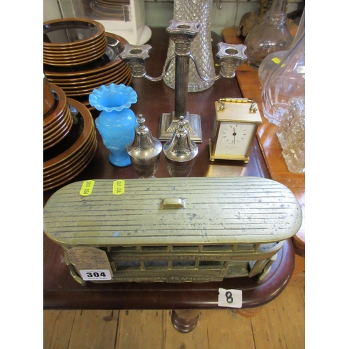 304 - CANDLESTICK, BRASS TROLLEY BUS, BLUE VASE, CARRIAGE CLOCK AND TWO METAL LIDDED URNS