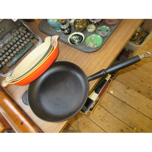 334 - THREE LE CRUESET CASSEROLE DISHES PLUS A FRYING PAN