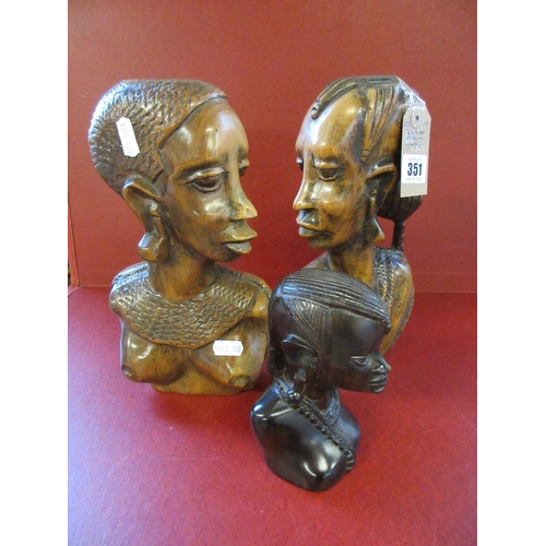 351 - THREE CARVED AFRICAN HEADS