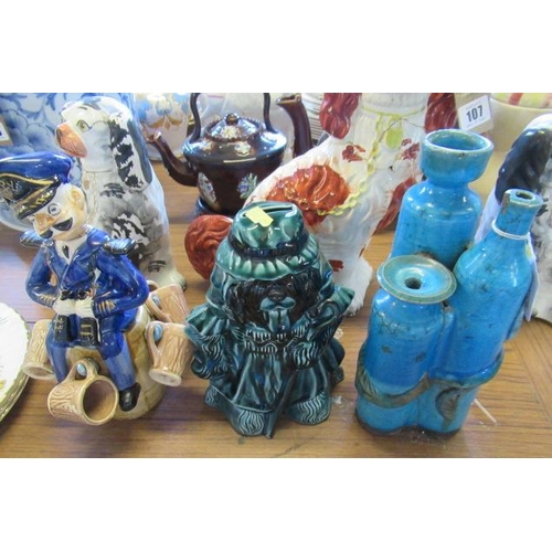 106 - SAILOR RUM DECANTER, SIX TOPS A SHEEP DOG MONEY BOX AND STUDIO POTTERY TRIPLE VASE