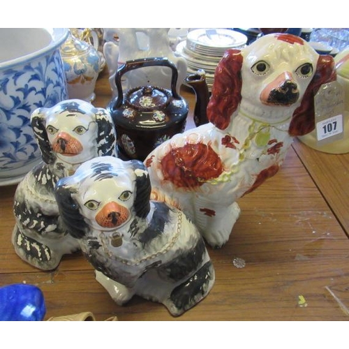 107 - THREE STAFFORDSHIRE DOGS