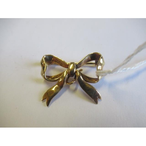 184 - 9CT GOLD BOW BROOCH 3.8g