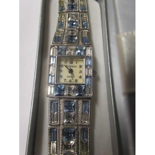 224 - BOXED SOLITAIRE WRISTWATCH ON A CRYSTAL STRAP