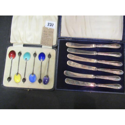 237 - CASE OF SILVER HANDLED KNIVES AND CASE OF SILVER AND ENAMEL COFFEE SPOONS