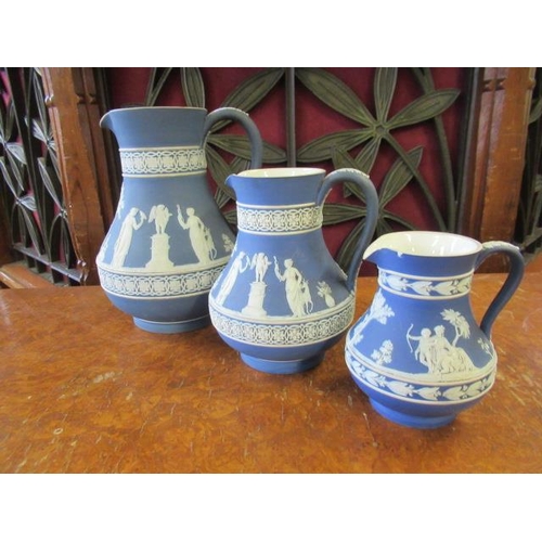 465 - THREE WEDGWOOD JASPERWARE JUGS