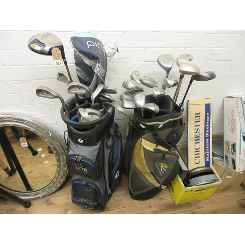 521 - TWO GOLF BAGS WITH CLUBS