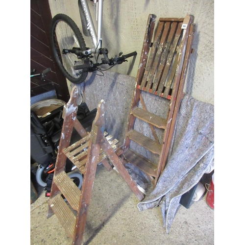 561 - TWO PAIRS OF WOODEN STEPLADDERS