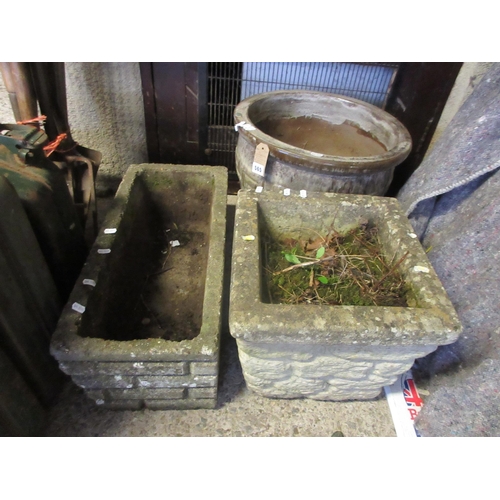 565 - TWO COMPOSITE GARDEN PLANTERS AND A LARGE CERAMIC POT