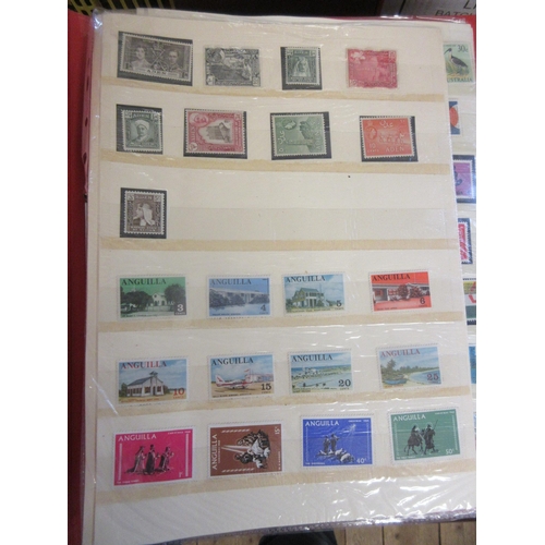 661 - FOUR ALBUMS OF MINT AND USED BRITISH OVERSEAS TERRITORIES STAMPS