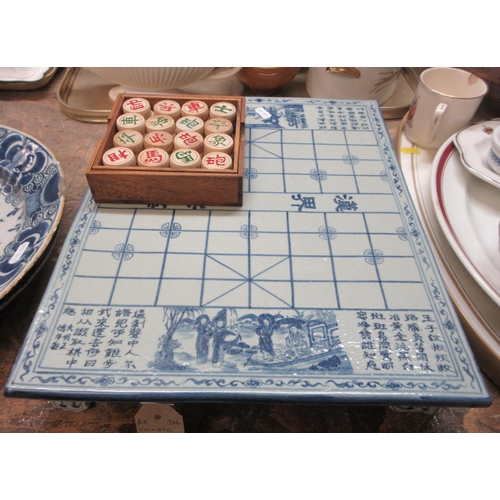 74 - CHINESE GAME TILES AND CERAMIC BOARD