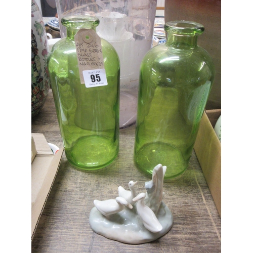 95 - PAIR OF GREEN GLASS BOTTLES AND NAO GEESE