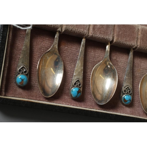 113 - A SET OF SIX ARTS AND CRAFTS COFFEE SPOONS by Bernard Instone for Langstone Silver Works, Birmingham... 