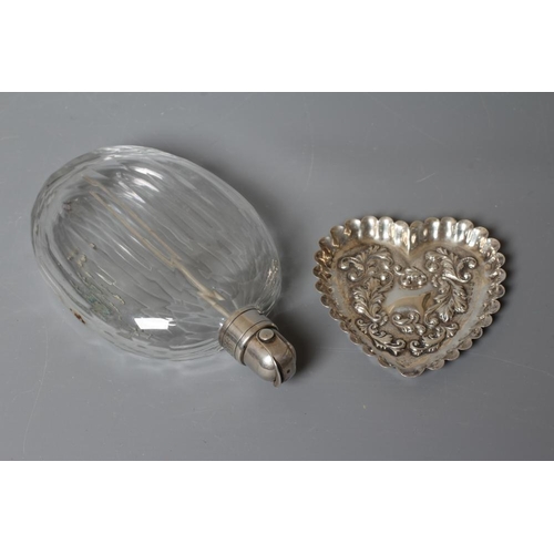 134 - A VICTORIAN SCENT FLASK by Thomas Johnson I, London 1875, the panel cut clear glass flattened oval f... 