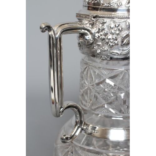 138 - AN EDWARDIAN CLARET JUG by W. & C. Sissons, Sheffield 1906, the slice, strawberry and star cut clear... 