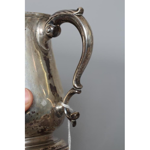 146 - A LATE GEORGE II MUG by Thomas Whipham & Charles Wright, London 1761, of baluster form on a spreadin... 