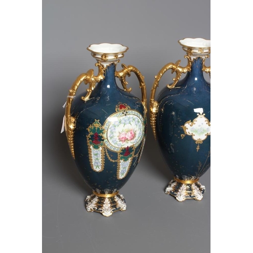 16 - A PAIR OF ROYAL CROWN DERBY CHINA VASES, 1925, of ovoid form with waisted necks and two gilded leaf ... 