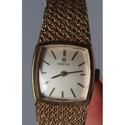 167 - A LADY'S 9CT GOLD OMEGA WRISTWATCH, the slightly convex rounded square mat silvered dial with applie... 