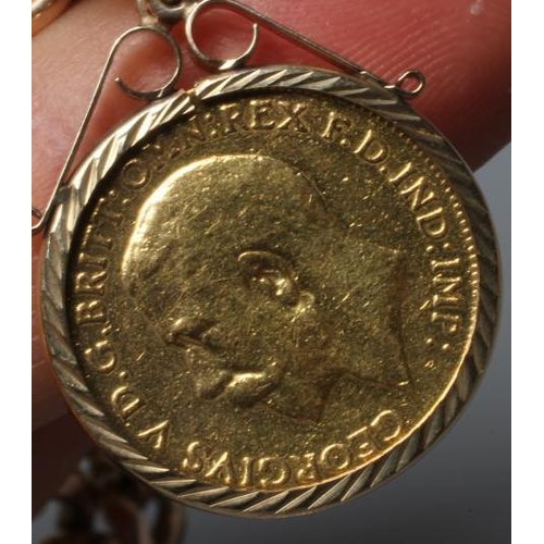 169 - TWO GEORGE V HALF SOVEREIGNS, 1912, in 9ct gold loose mounts pendant from a 9ct gold curb link chain... 