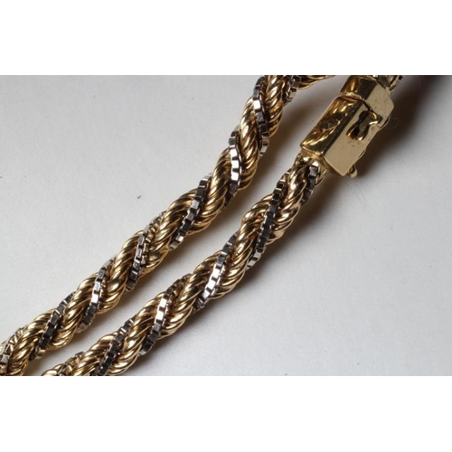 188 - A BI-COLOUR ROPE TWIST NECKLACE stamped 750, the yellow rope chain twisted with a white box link cha... 