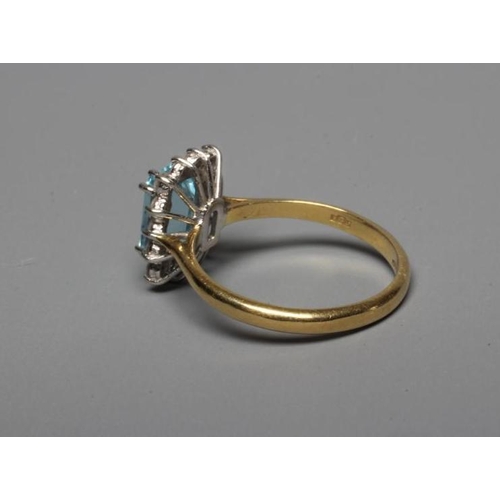 233 - AN AQUAMARINE AND DIAMOND SQUARE CLUSTER RING, the facet cut oblong aquamarine claw set to a border ... 