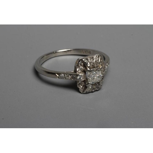 245 - AN ART DECO DIAMOND COCKTAIL RING, the central Princess cut stone claw set to a domed border set wit... 