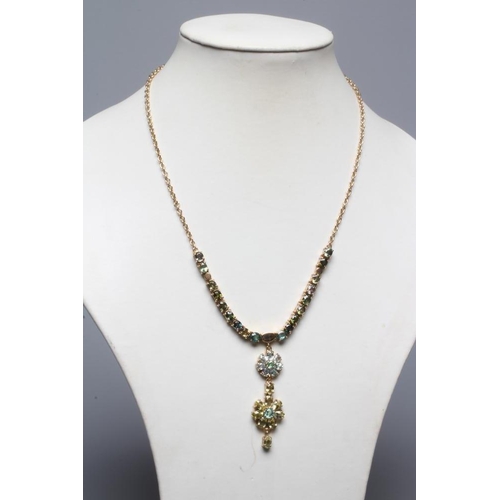 247 - A TOURMALINE FLOWERHEAD NECKLACE, the two mixed colour graduated flowerhead pendants hanging from a ... 