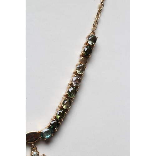 247 - A TOURMALINE FLOWERHEAD NECKLACE, the two mixed colour graduated flowerhead pendants hanging from a ... 