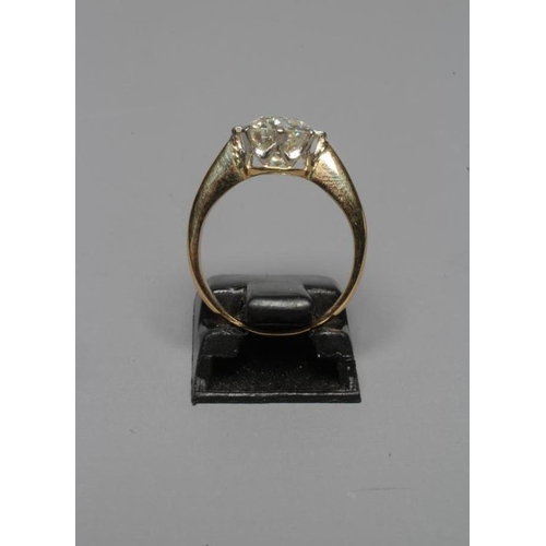 254 - A SOLITAIRE DIAMOND RING, the brilliant cut stone of approximately 2cts, claw set to a plain unmarke... 