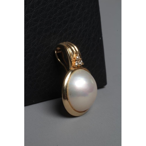 258 - A MABE PEARL PENDANT collet set to a plain frame below a reeded bale set with three small diamonds, ... 