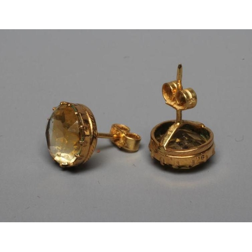 265 - A PAIR OF LATE VICTORIAN CITRINE EAR STUDS, the circular facet cut stones collet set in plain mounts... 