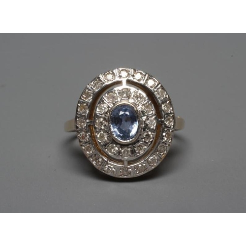 270 - AN ART DECO STYLE SAPPHIRE AND DIAMOND TARGET RING, the central collet set oval facet cut pale sapph... 