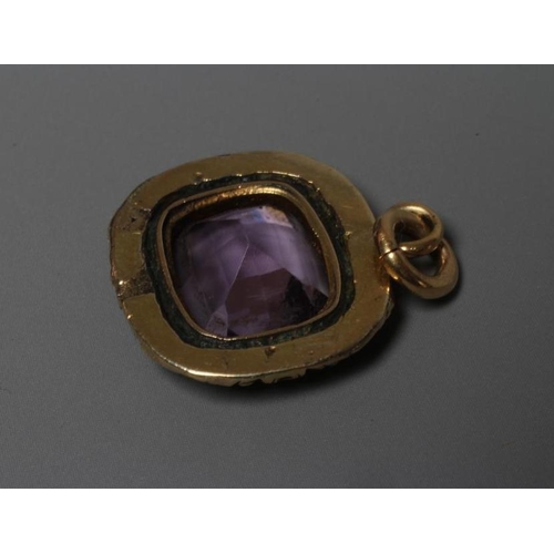 271 - A VICTORIAN AMETHYST PENDANT, the facet cut cushion shaped stone collet set in a foliate carved unma... 