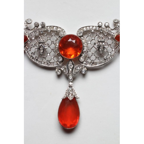 276 - A FIRE OPAL AND DIAMOND NECKLACE BY W. PHILLIPS, the briolette type cut opal drop with husk mount pe... 