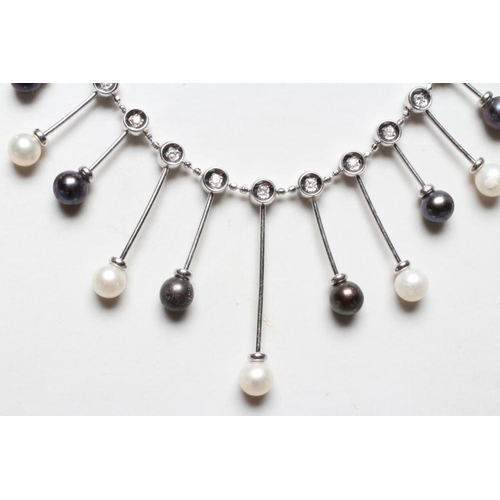 282 - A TAHITIAN BLACK AND WHITE CULTURED PEARL FRINGE NECKLACE, the thirteen wire bars each with an illus... 