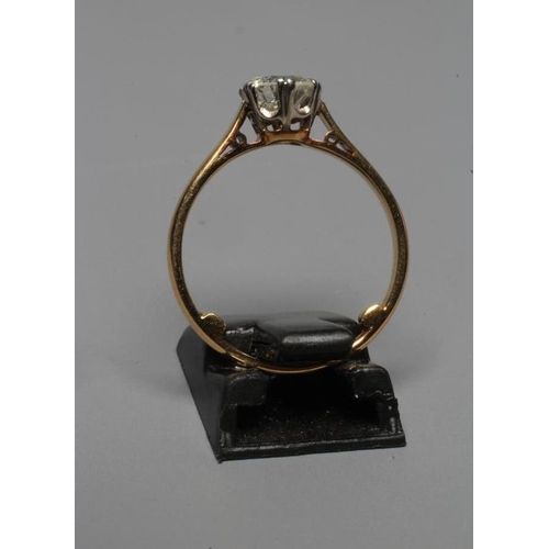 283 - A SOLITAIRE DIAMOND RING, the brilliant cut stone of approximately 1ct, claw set to a plain shank, s... 