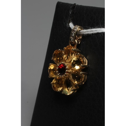 285 - A MULTI-GEM FLOWERHEAD CLUSTER PENDANT centred by a circular facet cut garnet with seven citrine pet... 