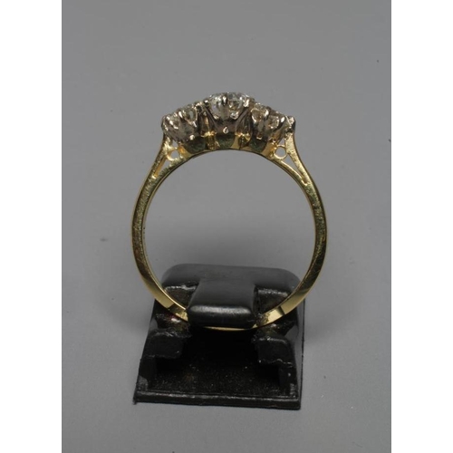 297 - A THREE STONE DIAMOND RING, the brilliant cut stones totalling 1.25cts, claw set to a plain shank st... 