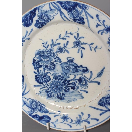 35 - A PAIR OF DELFT PLATES, possibly Lambeth c.1755, of plain circular form centrally painted in blue wi... 