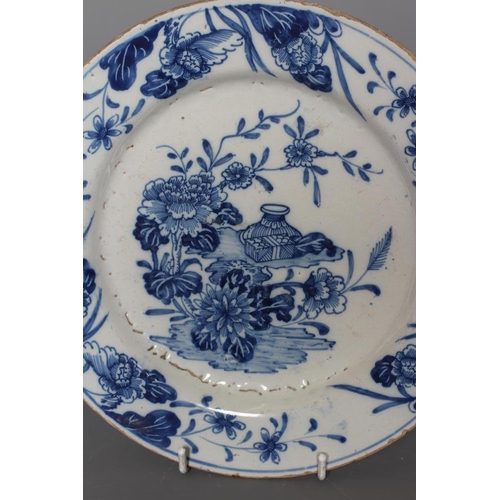 35 - A PAIR OF DELFT PLATES, possibly Lambeth c.1755, of plain circular form centrally painted in blue wi... 