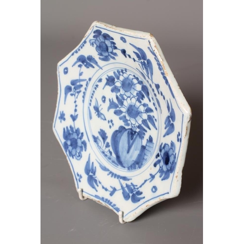 36 - AN OCTAGONAL DELFT PLATE, Bristol c.1700, centrally painted in blue in a loose Chinese style with a ... 