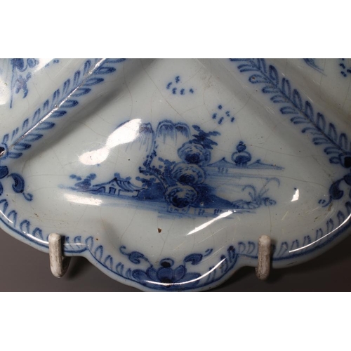 37 - A DELFT SWEETMEAT FOUR SECTION DISH, London or Liverpool c.1760, of lobed form raised upon three peg... 