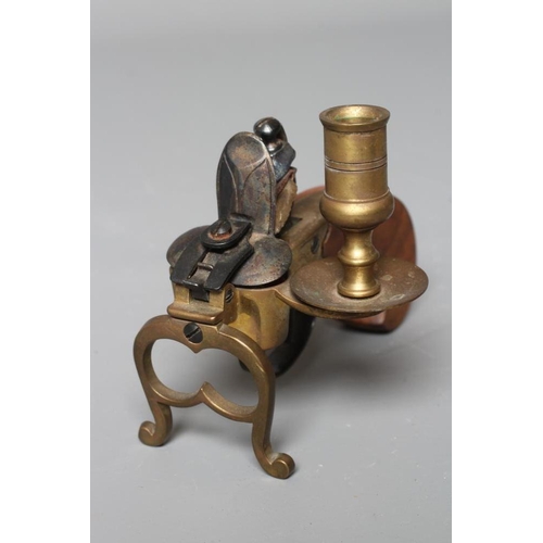 377 - A FLINTLOCK TINDER LIGHTER, early 20th century, with candle holder, brass foliate etched action, woo... 