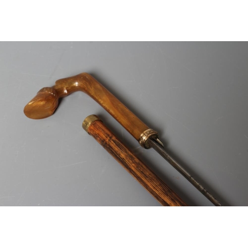 387 - A LATE VICTORIAN SWORD STICK with a button released 26